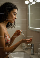 Elegant Woman Applying Serum Skincare in Bathroom Mirror