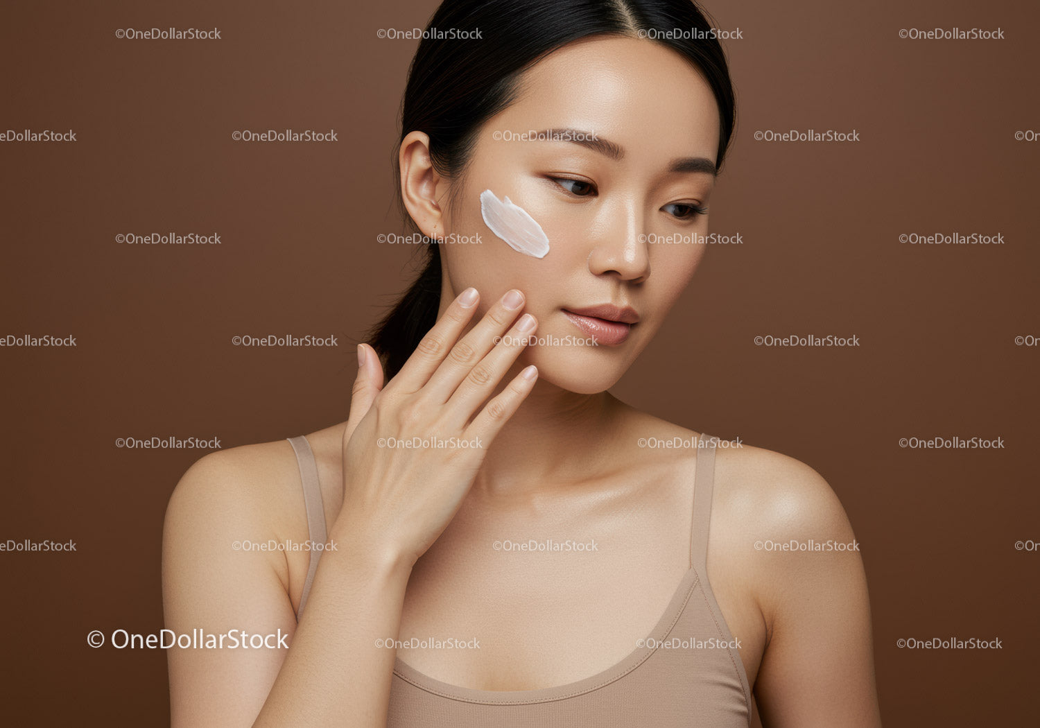 Young Woman Applying Moisturizer for Naturally Beautiful Skin