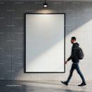 Blurred man walking past blank poster on concrete wall
