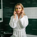 Woman Applying Gold Eye Patches for Skin Rejuvenation