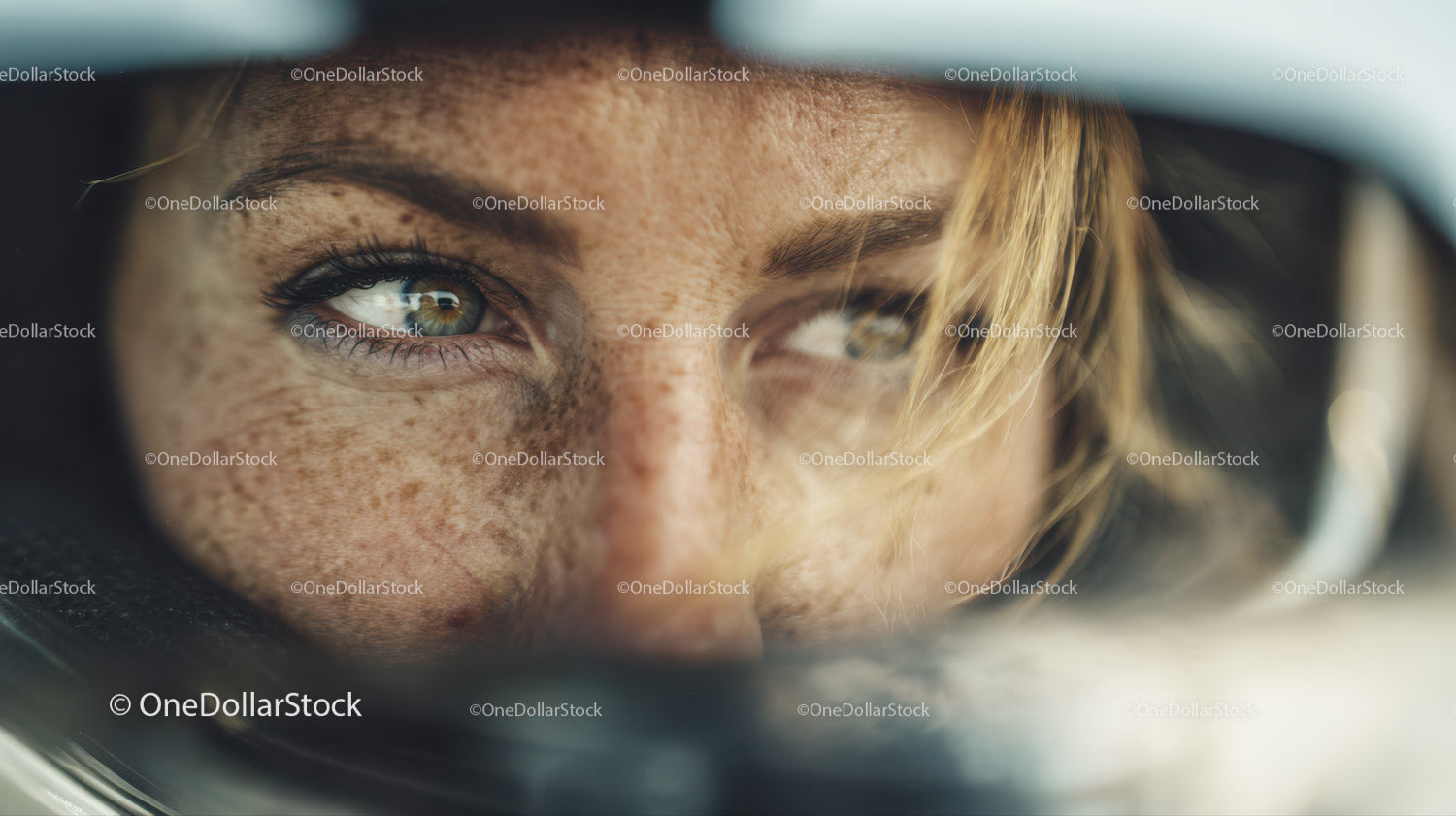 Close Up of Young Woman with Green Eyes, Freckles and Blonde Hair