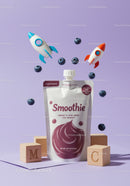 Blueberry smoothie pouch with playful rocket toys and blocks