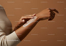 Close-up of Woman Applying Lotion to Arm for Skin Hydration