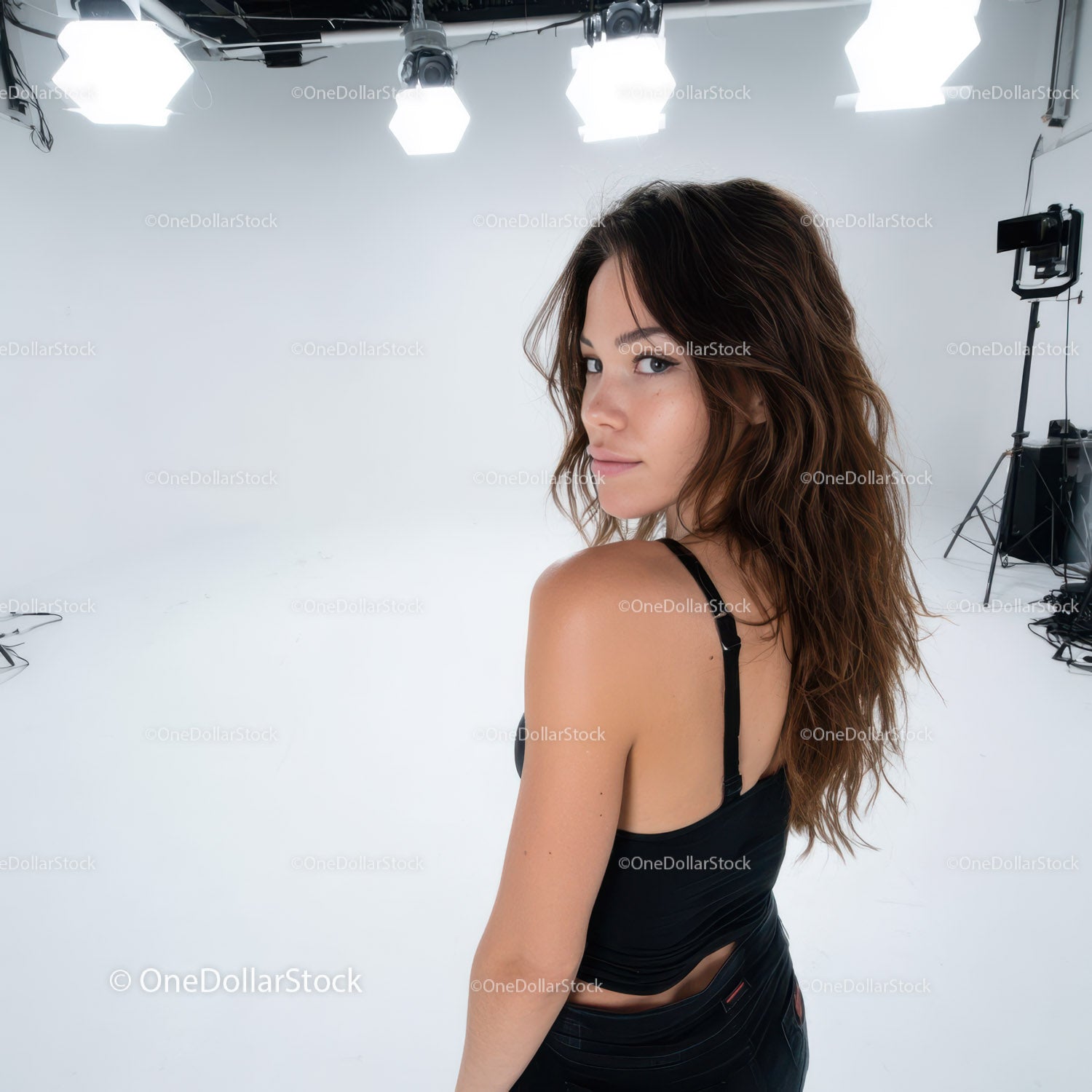 Young Woman in Black Tank Top Posing in Fashion Studio