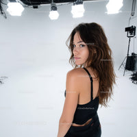 Young Woman in Black Tank Top Posing in Fashion Studio