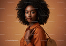 Portrait of a Stylish Black Woman with Natural Curly Hair in Brown Leather Jacket