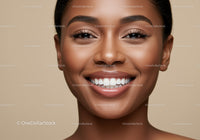 Close up portrait of smiling young woman with clear skin