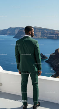 Man in green suit enjoying ocean view on terrace