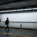 Minimalist Subway Tunnel with Tiled Walls and Modern Lighting