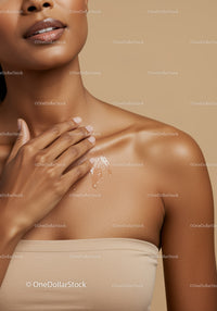 Close-Up of a Woman Applying Moisturizer on Her Shoulder for Skin Care