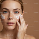 Portrait of a Woman Applying Skincare Cream on Her Face for Hydrated Skin