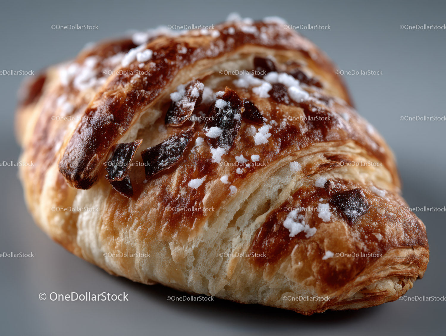 Chocolate Croissant with Flaky Layers and Powdered Sugar