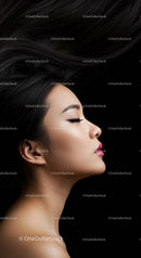 Elegant woman with flowing hair and closed eyes profile