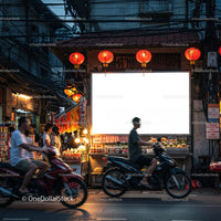 Evening street scene with motorbikes and red lanterns