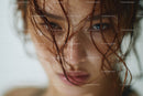 Close-Up of a Wet-Haired Woman with Water Droplets on Skin