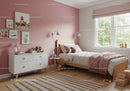 Cozy Children's Bedroom with Pink Wall and Natural Light