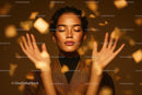 Elegant Woman with Gold Confetti in Warm Studio Lighting