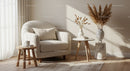 Cozy armchair with natural decor in sunlit living room