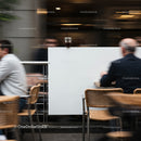Cold drink left on dividing wall in busy cafe scene