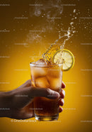 Refreshing iced tea with lemon slice and splash