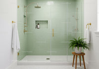 Modern green tiled walk in shower with glass doors