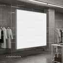 Blank white display board in modern clothing store interior