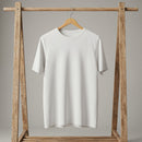 Minimalist white t-shirt hanging on wooden rack