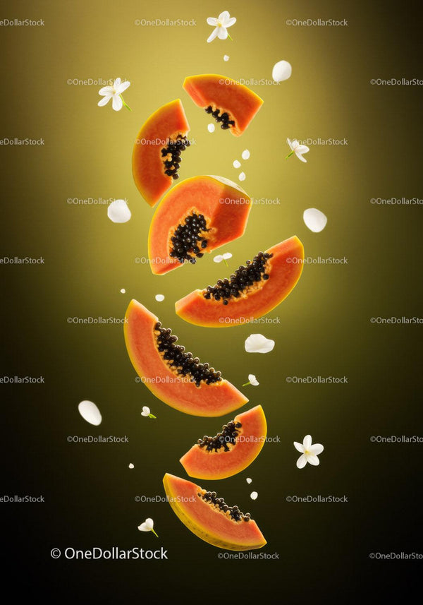 Fresh Papaya Slices Falling with White Flowers