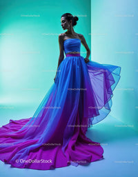 Elegant Woman in Vibrant Blue Gown with Flowing Fabric in Studio