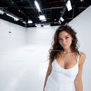 Portrait of a Young Woman in White Tank Top in Studio with Bright Lighting