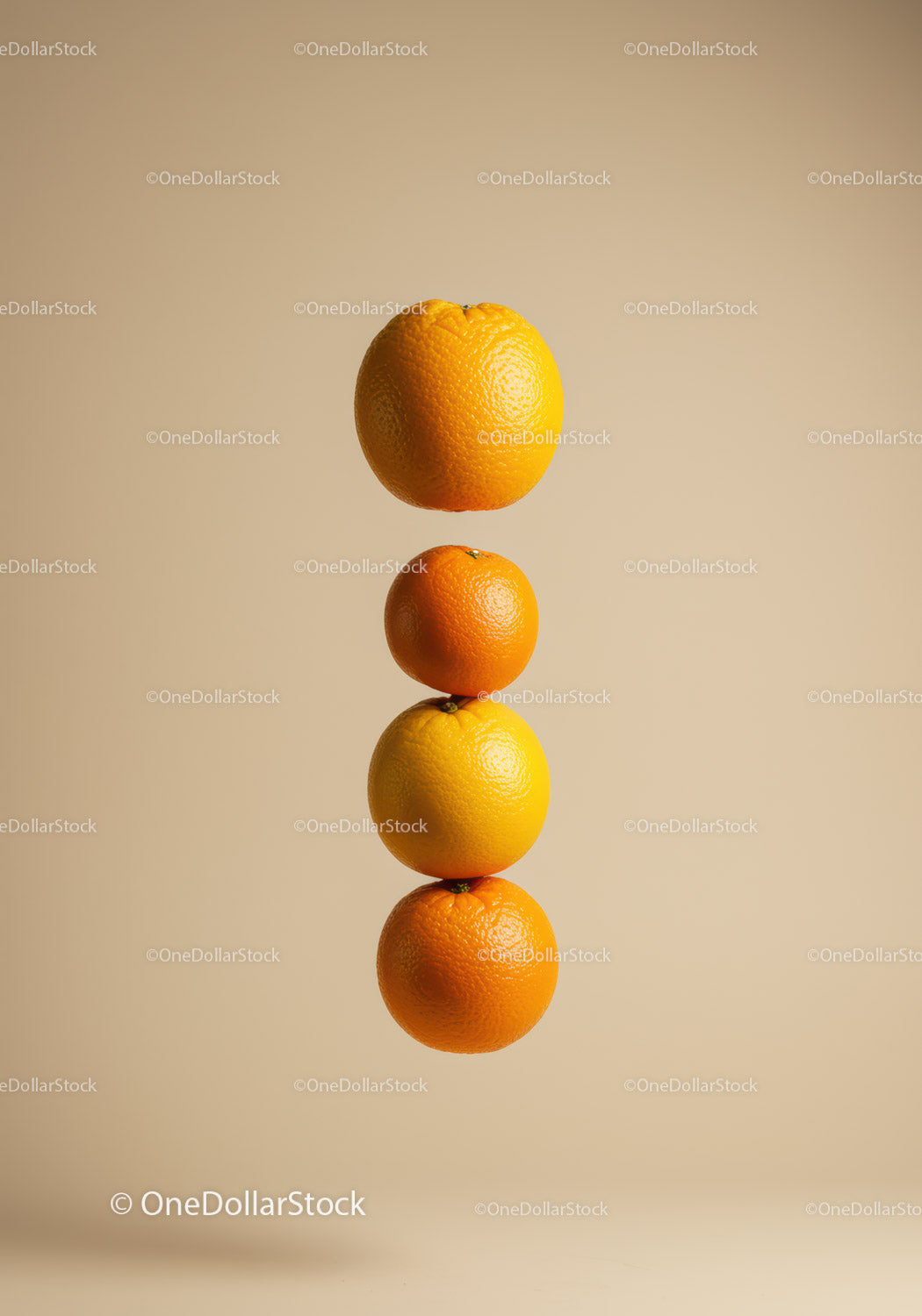 Four Citrus Fruits Balanced in Vertical Floating Stack