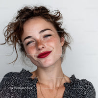 Headshot of Smiling Woman with Freckles and Red Lipstick