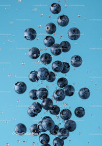 Fresh Blueberries Immersed in Clear Water Splash