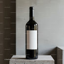 Elegant wine bottle with blank label on concrete surface