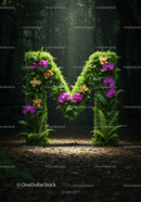 Letter M formed by vibrant flowers and lush greenery
