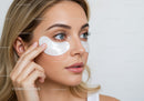 Woman Applying Eye Patches for Skincare Routine