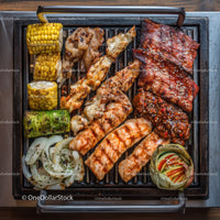 Assorted Grilled Meat and Vegetables on Barbecue Grill
