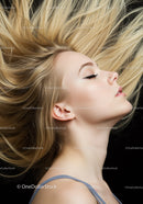 Profile of young woman with flowing blonde hair