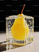 Fresh pear frozen inside a clear ice cube