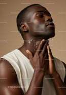 Close-Up of Black Man Applying Skincare Lotion on Neck