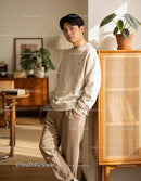 Young man relaxing indoors in warm natural light