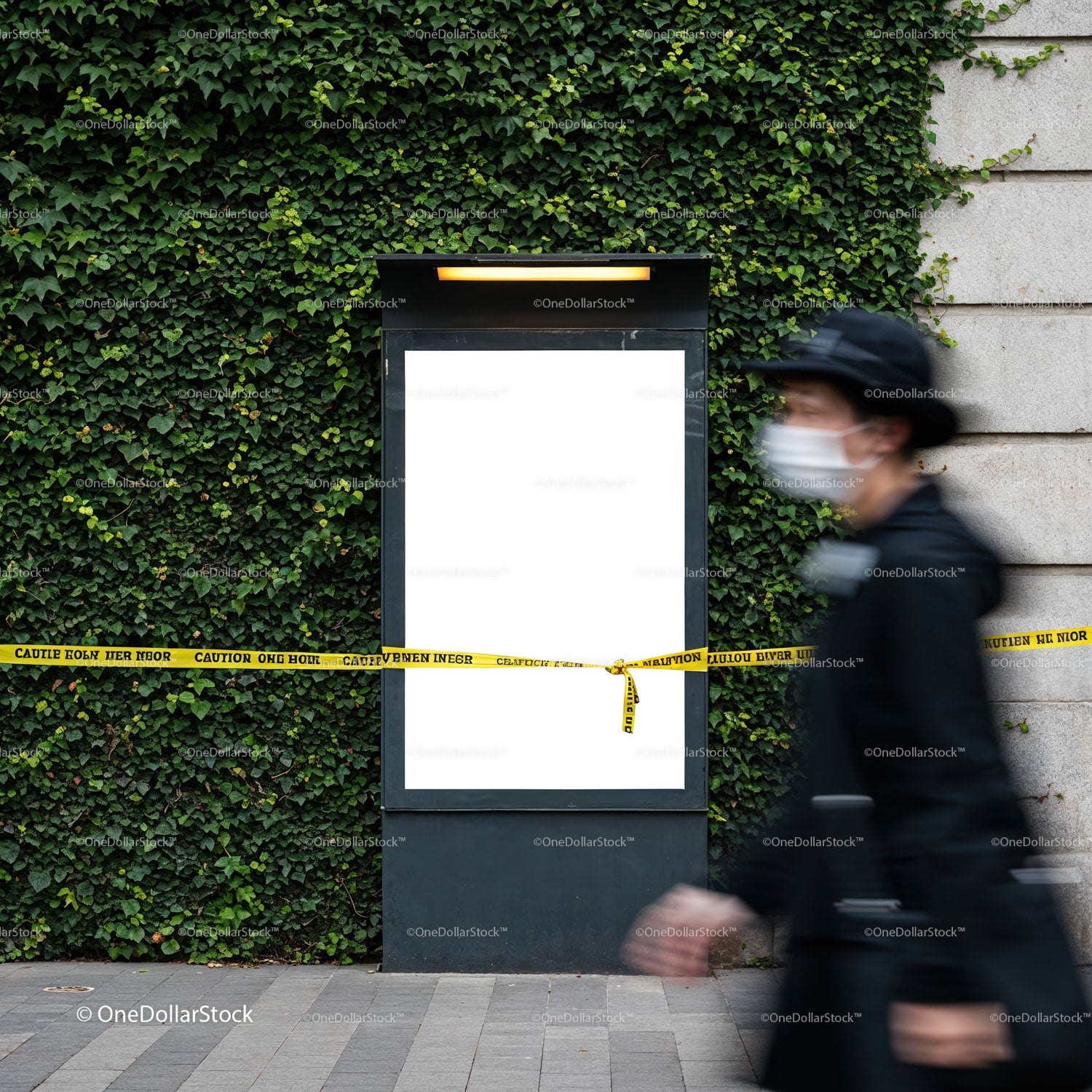 Urban blank billboard with caution tape on green wall