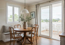 Cozy dining nook with wooden table and natural light