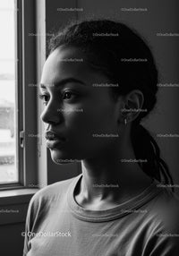 Black and White Portrait of a Thoughtful Woman by a Window