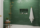 Modern Bathroom with Green Tiles and Gold Fixtures