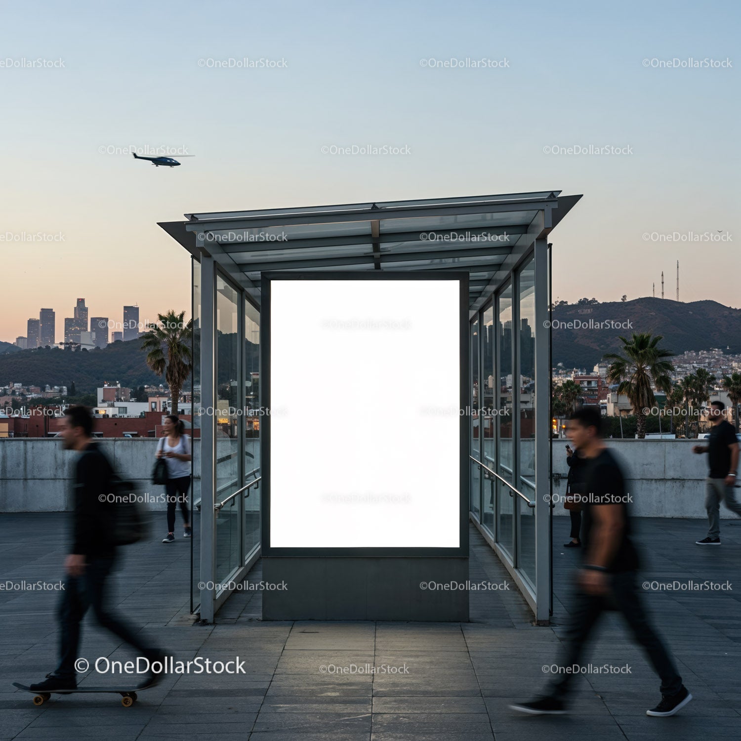 Urban bus shelter with blank ad at sunset and passing people