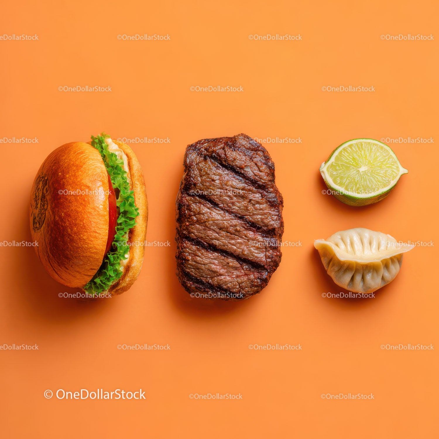 Gourmet Burger with Lettuce and Tomato Next to Grilled Steak and Dumpling