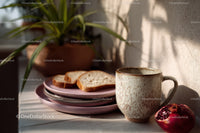 Ceramic Mug with Slices of Bread and Houseplant on a Sunlit Table