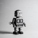 Retro Black and Silver Metal Robot Toy with Glowing Eyes