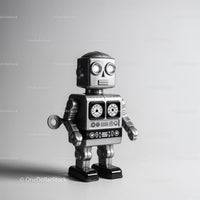 Retro Black and Silver Metal Robot Toy with Glowing Eyes
